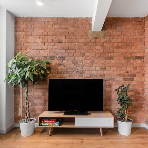 Kick back in the warehouse-style living room with a board game and a glass of wine
