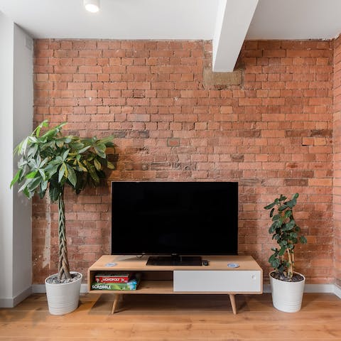 Kick back in the warehouse-style living room with a board game and a glass of wine