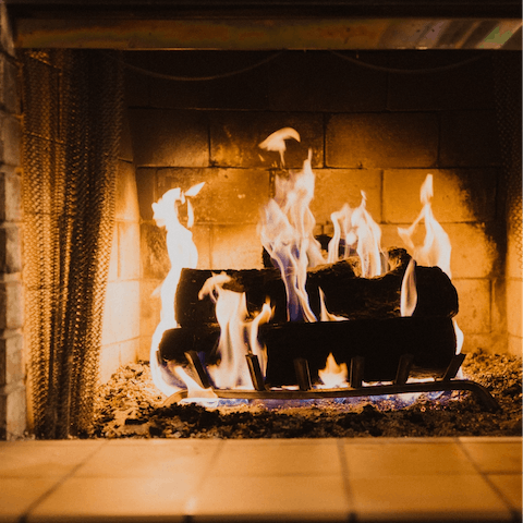 Snuggle up by the living room's log stove