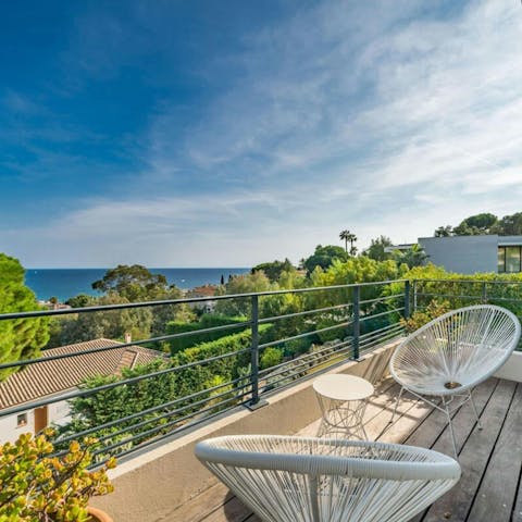 Admire sea views over cocktails on the balcony