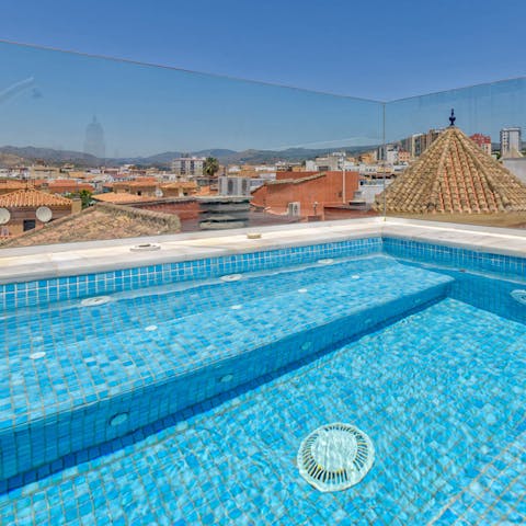 Float in the rooftop swimming pool on hot days