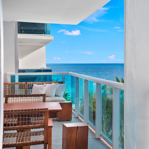 Sip cocktails while admiring ocean views on the balcony