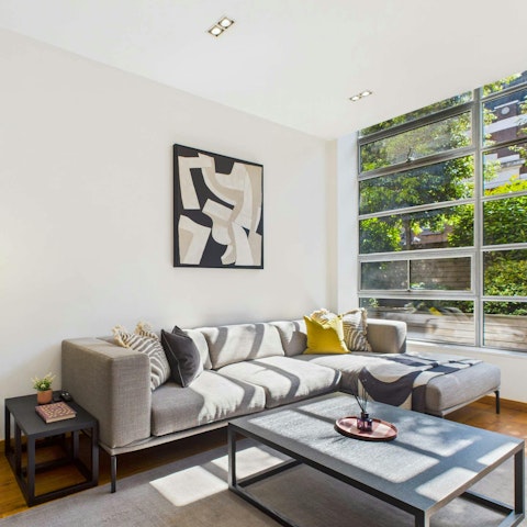 Curl up with a book beside floor-to-ceiling windows