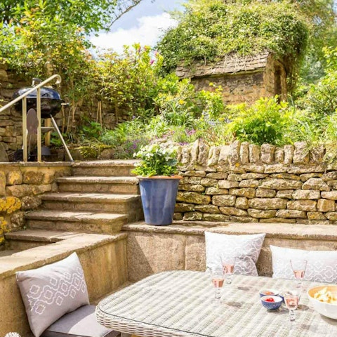 Sip an evening aperitif in the pretty cottage garden