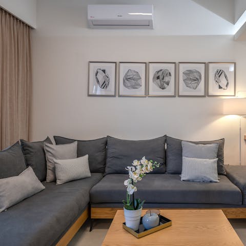 Kick back and relax on the plush sofa, snuggling up for an evening of movies and wine