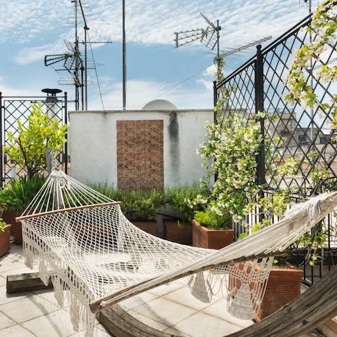 Soak up the sun from this hammock as you put your nose in a good book