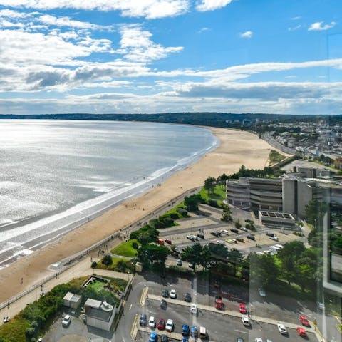 Spend your days at the sandy beach, views of which you have from the apartment – it's just a five-minute walk away