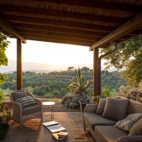 Watch the sunset on the terrace, glass of wine in hand