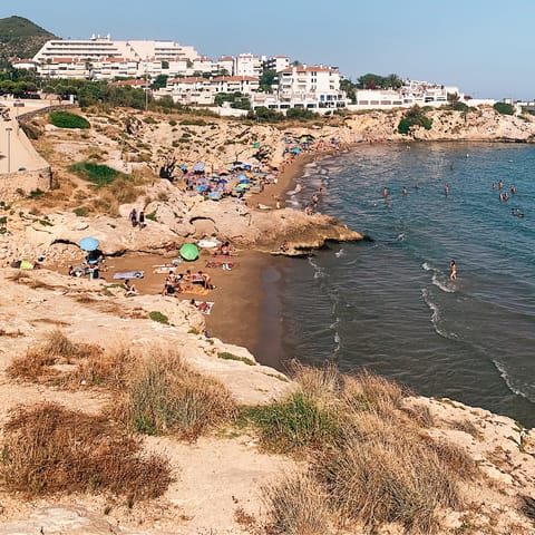 Spend the day on the beach in stylish Sitges, just over 6 miles away