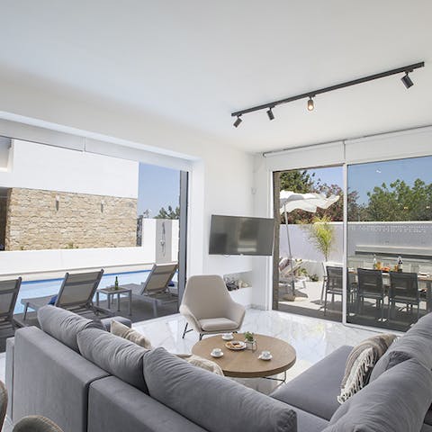 Appreciate natural sunlight from indoors with floor-to-ceiling windows and glass doors