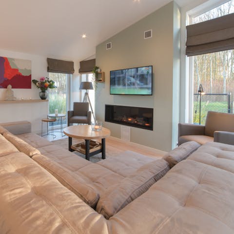 Cosy up by the fireplace in the living room