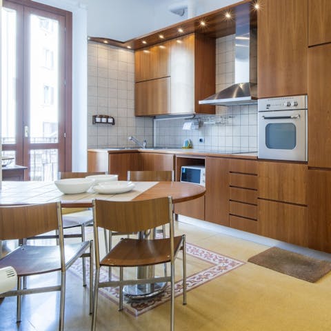 Open up the balcony doors in the kitchen and let the sunshine in