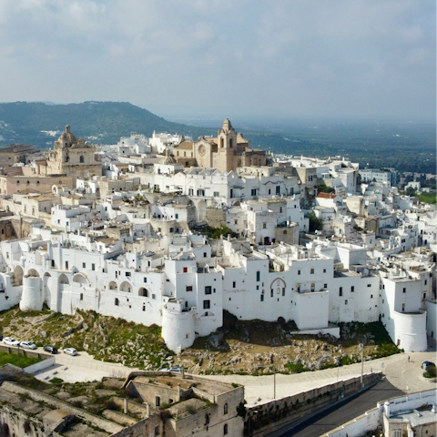 Visit the white-washed city of Ostuni – a thirty-five minute drive away