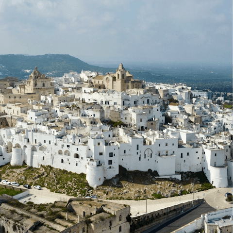 Visit the white-washed city of Ostuni – a thirty-five minute drive away