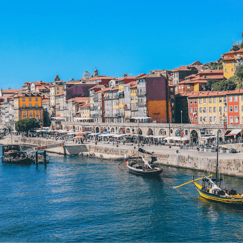 Explore bustling Cais da Ribeira, fifteen minutes away on foot