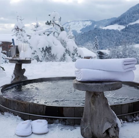 Sink into the outdoor hot tub with sweeping mountain views