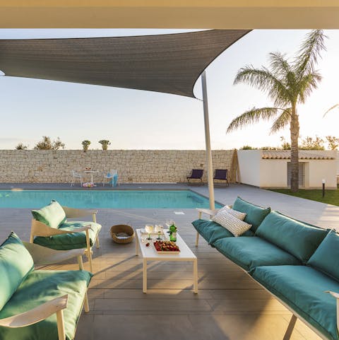 Sit out in the shade of the terrace and pour drinks as the sun sets on a busy day