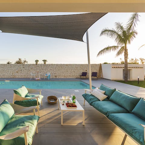 Sit out in the shade of the terrace and pour drinks as the sun sets on a busy day