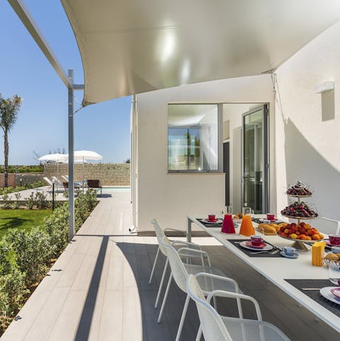 Gather around the outdoor dining table to tuck into a home-cooked meal alfresco