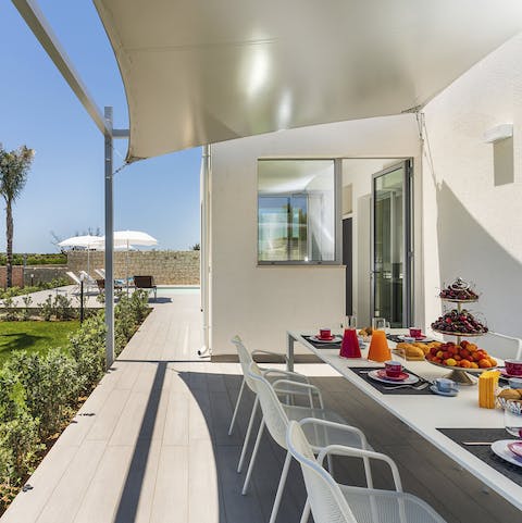 Gather around the outdoor dining table to tuck into a home-cooked meal alfresco