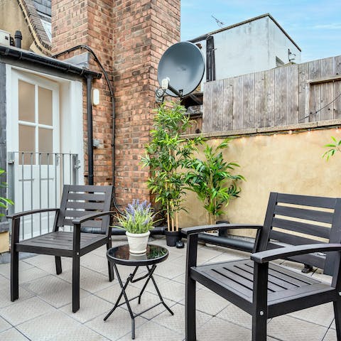 Drink alfresco wine on the rooftop patio