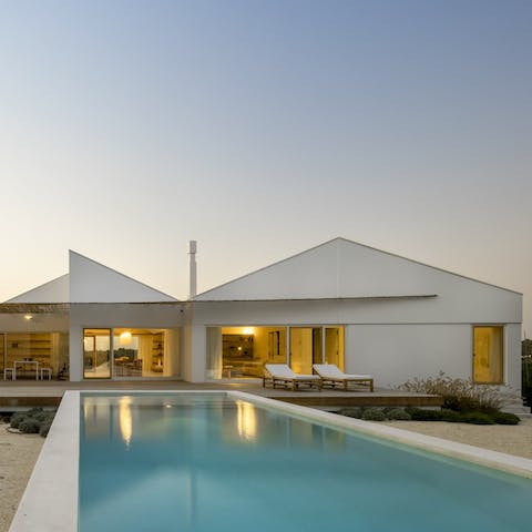 Catch the sun while watching beside the aquamarine pool, occasionally taking a dip