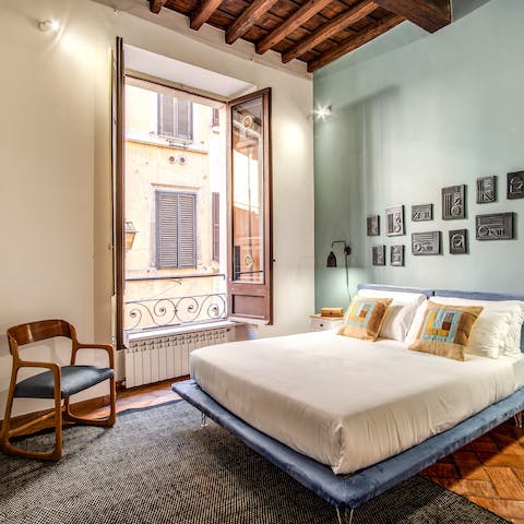 Wake up blissfully in your pastel-hued bedroom with the breeze washing over you