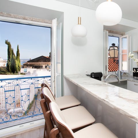 Admire the beautiful view of the Tagus River from the breakfast bar