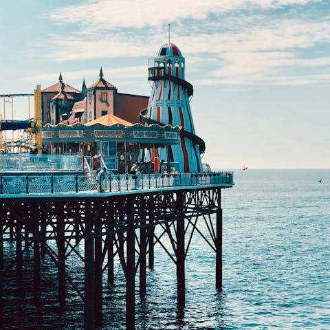 Visit Brighton's iconic pier, just a 10-minute stroll away