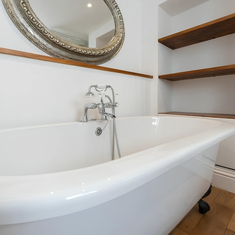 Soak in the bath after a day exploring the quaint boutiques and lively atmosphere