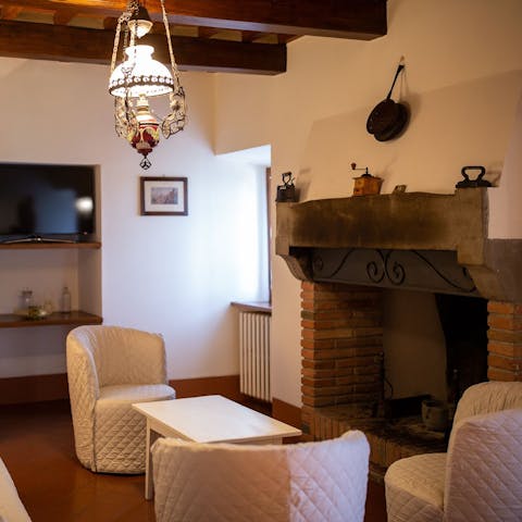 Enjoy a cosy evening in the traditional living area, cuddled up in front of the fire