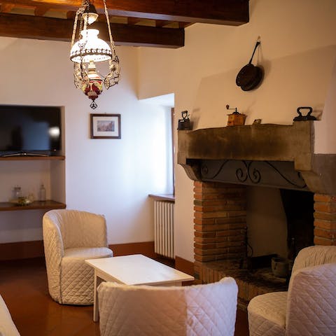 Enjoy a cosy evening in the traditional living area, cuddled up in front of the fire