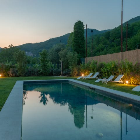 Take a sunset dip in the pool overlooking the hills
