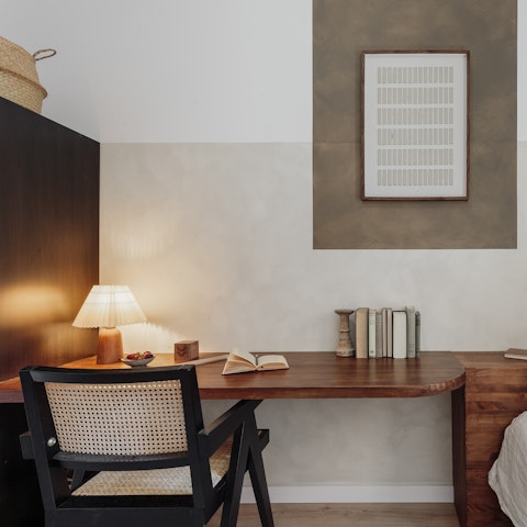 Work remotely at the big desk in the single bedroom