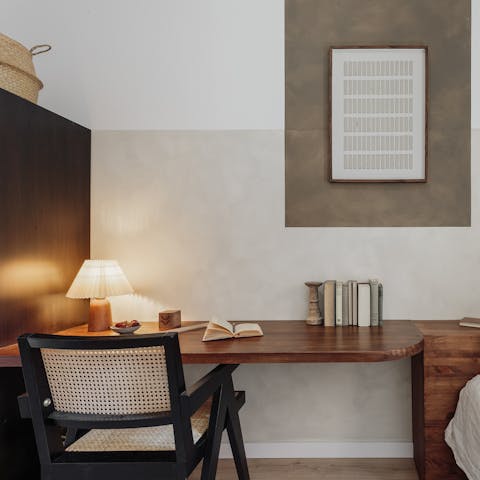 Work remotely at the big desk in the single bedroom
