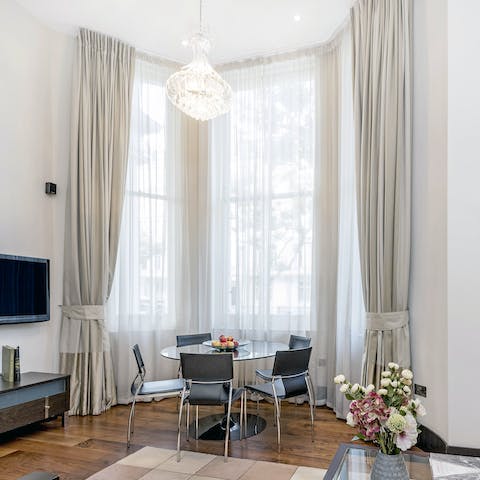 Sit down to an elegant meal beneath the chandelier