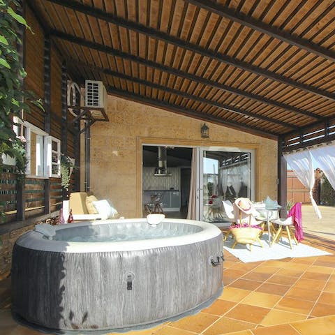Unwind in the hot tub with a glass of Mallorcan hierbas liqueur