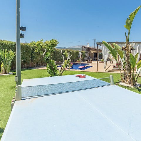 Enjoy a game of table tennis in the lush garden