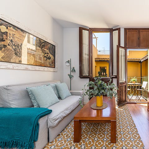 Relax in the living room with a glass of Spanish wine as the breeze flows in