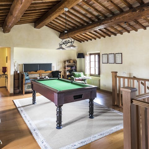Practice a game of pool with friends in the games room