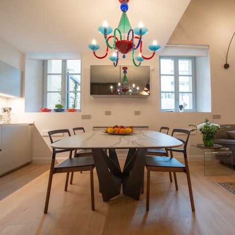 Tuck into delicious Italian meals under a colourful chandelier