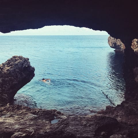 Head to Agioi Anargiroi for an invigorating swim in the Mediterranean Sea