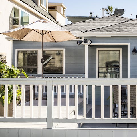 Relax on the sunny deck with a cool drink