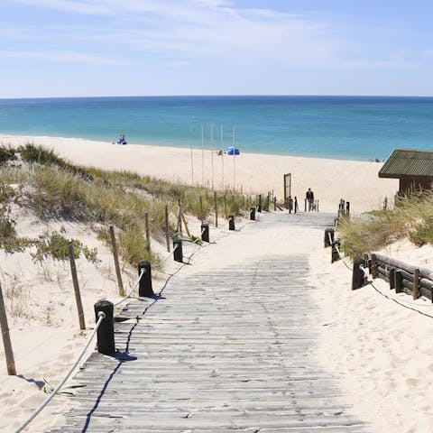 Kick off your sandals and make your way down the boardwalk to the nearby beach