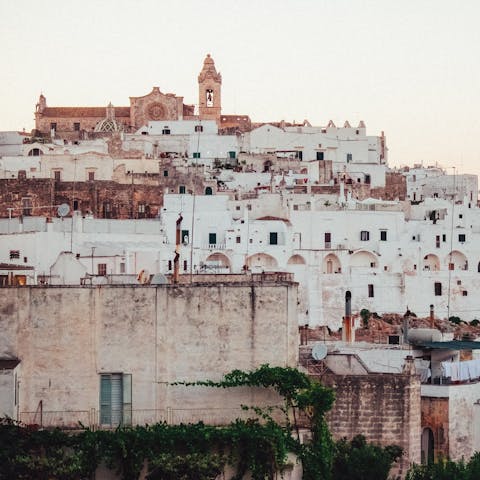 Explore the winding alleyways of historic Ostuni