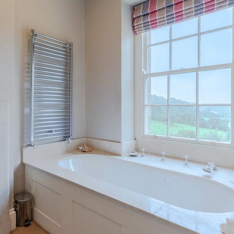 Admire the countryside views while soaking in the bathtub