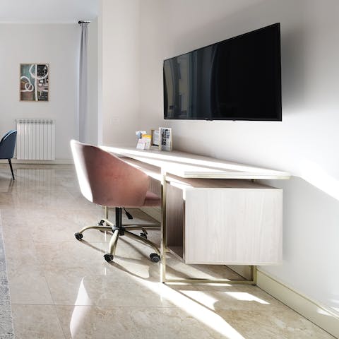 Catch up on work at the laptop-friendly desk in the living room