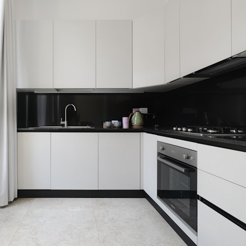 Cook pasta al dente in the sleek, monochrome kitchen