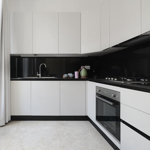 Cook pasta al dente in the sleek, monochrome kitchen