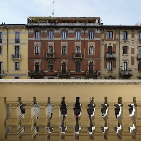 Look out over the grand Milanese street from your little balcony